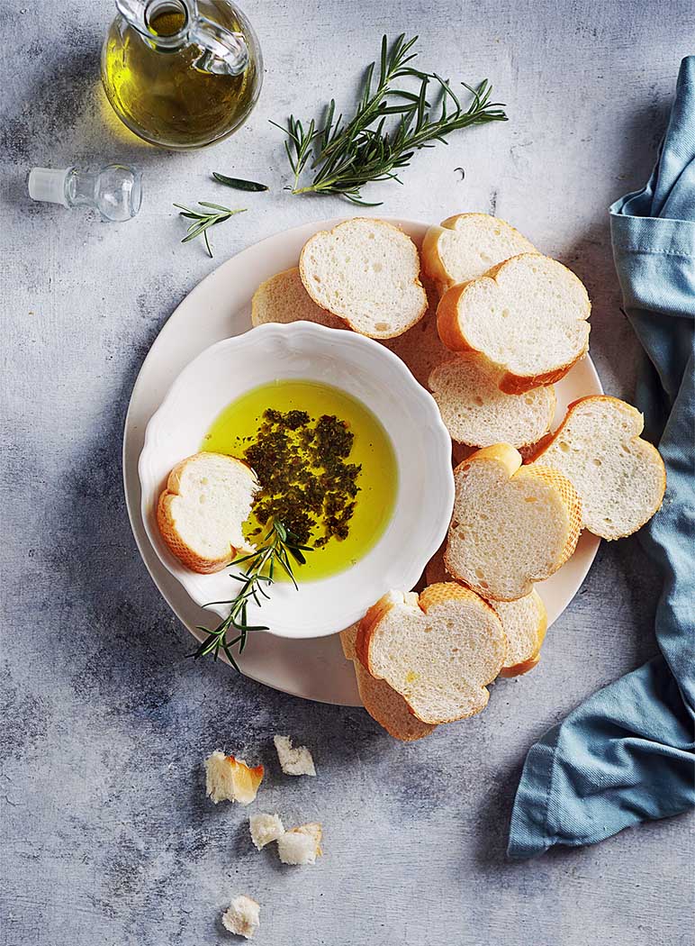 herbs & olive oil in a bowl with French bread
