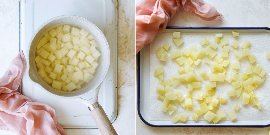 Cubed potatoes in a small saucepan with water. and then being drained on paper towels