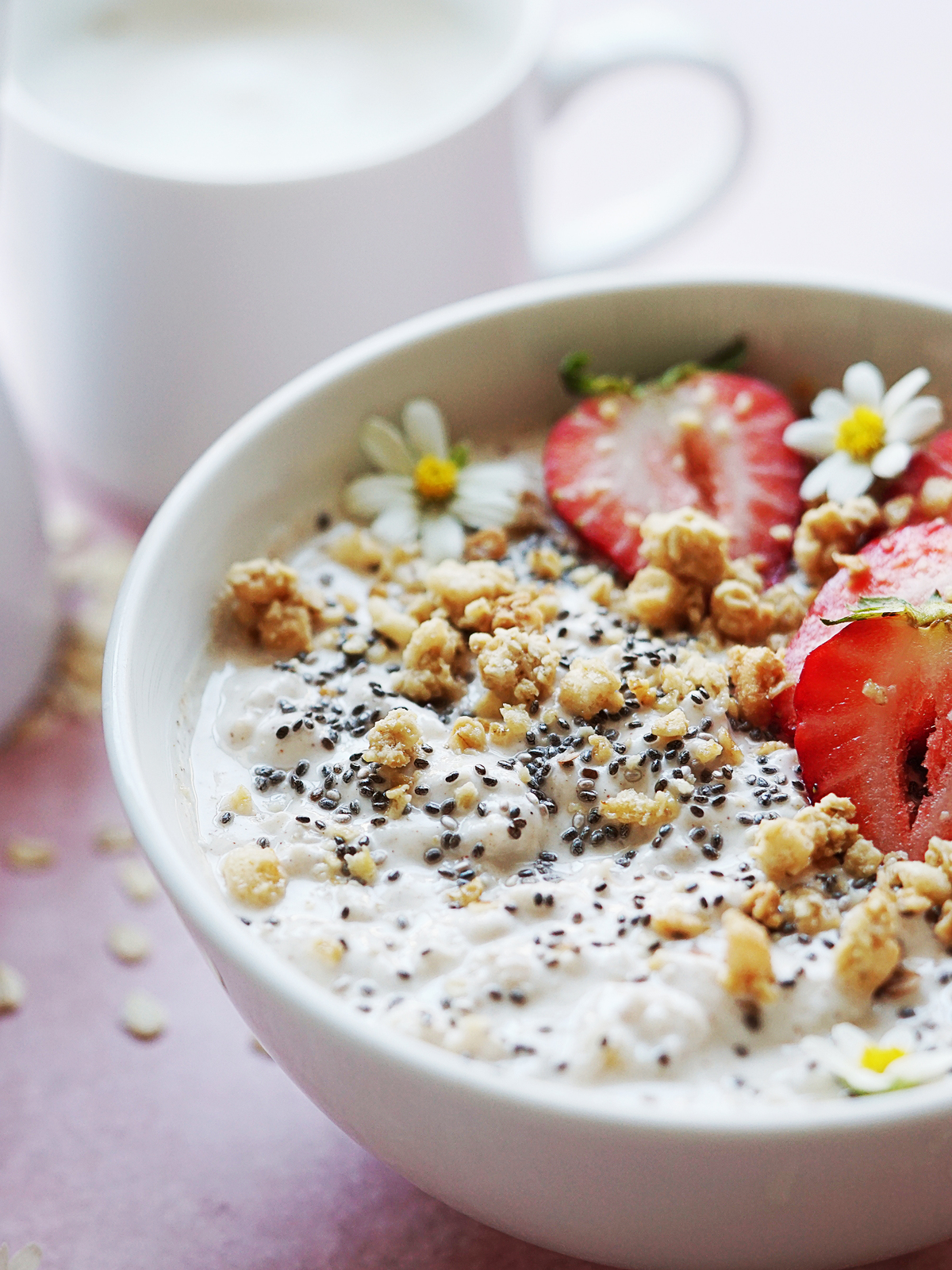 Close up photo of oats and greek yogurt in a white bowl