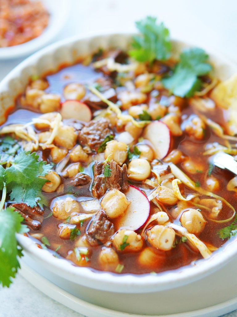 Close up image of pozole in a bowl
