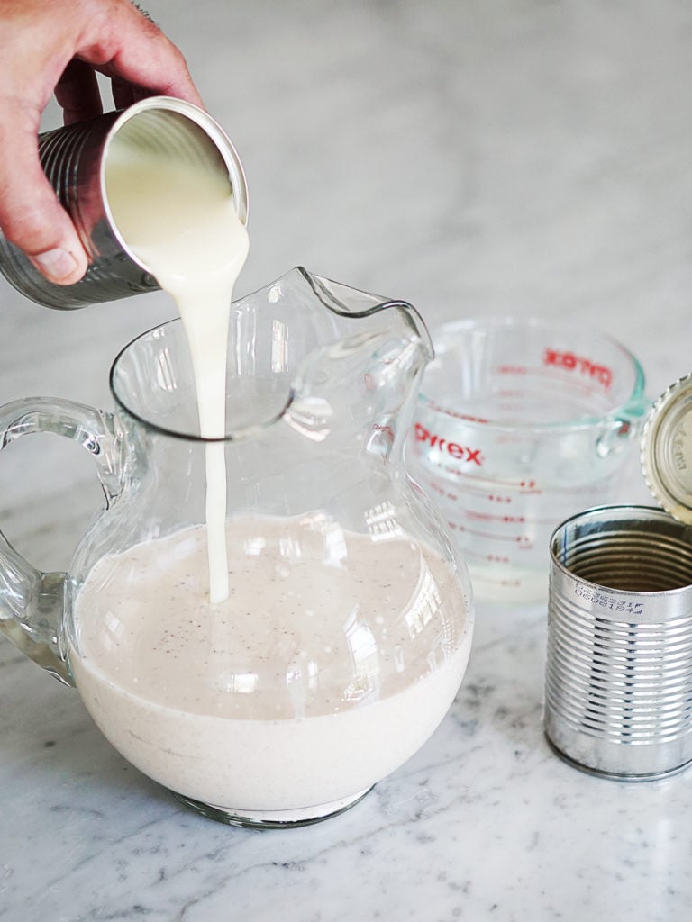 Pouring condensed milk in a jar