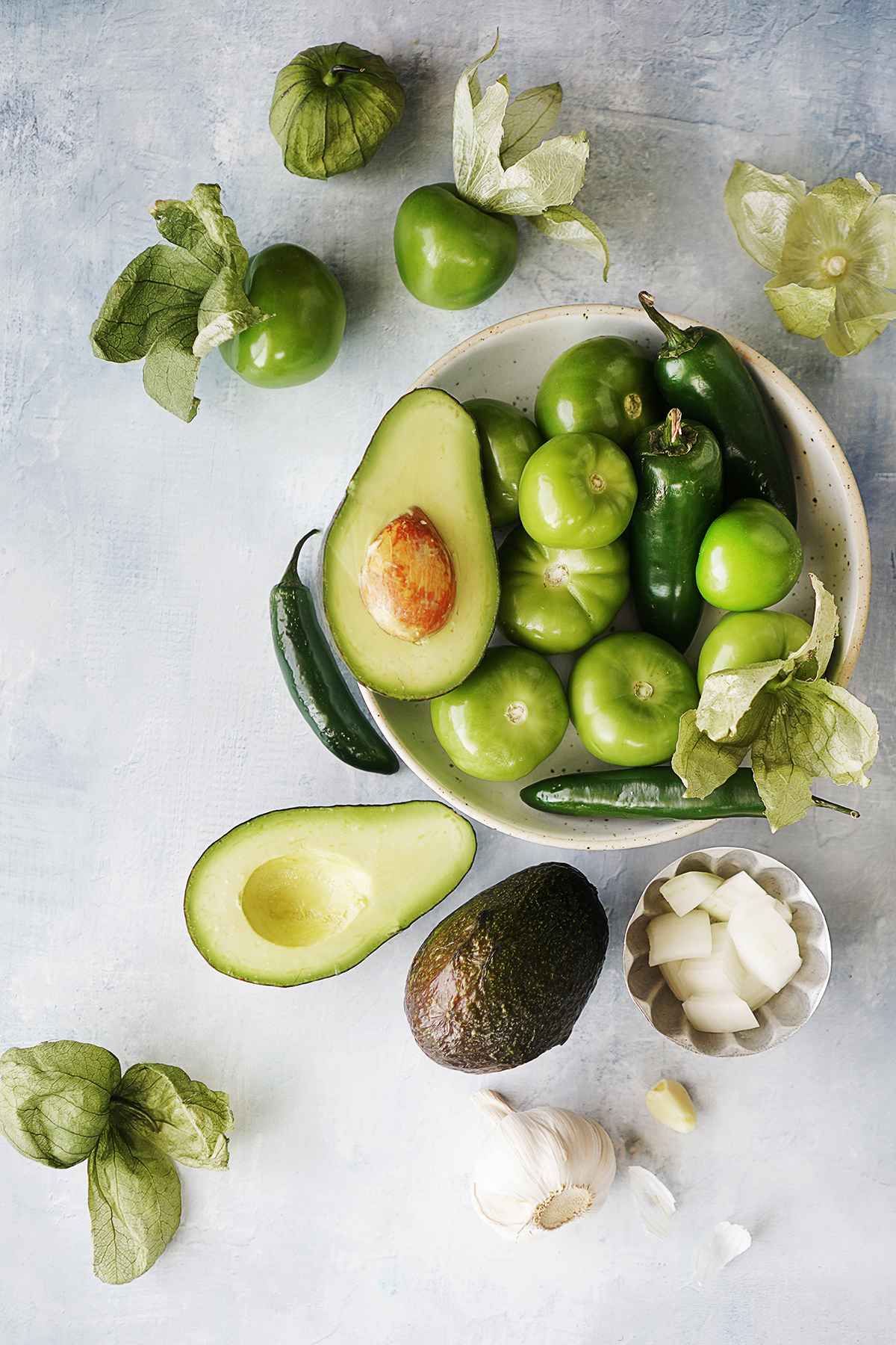 Ingredients: tomatillos, avocados, serrano and jalapeño peppers, onion & a garlic clove