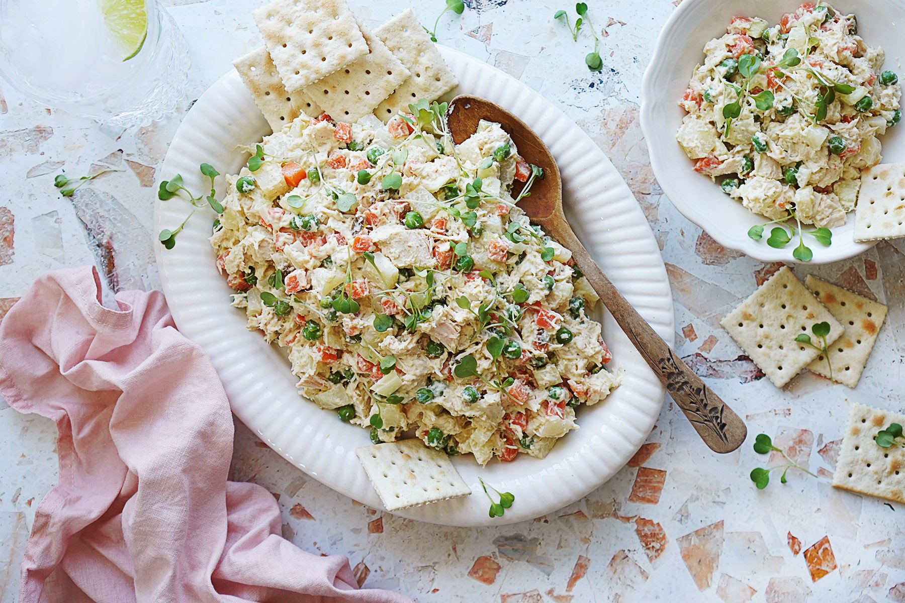 A white serving platter with mexican chicken salad