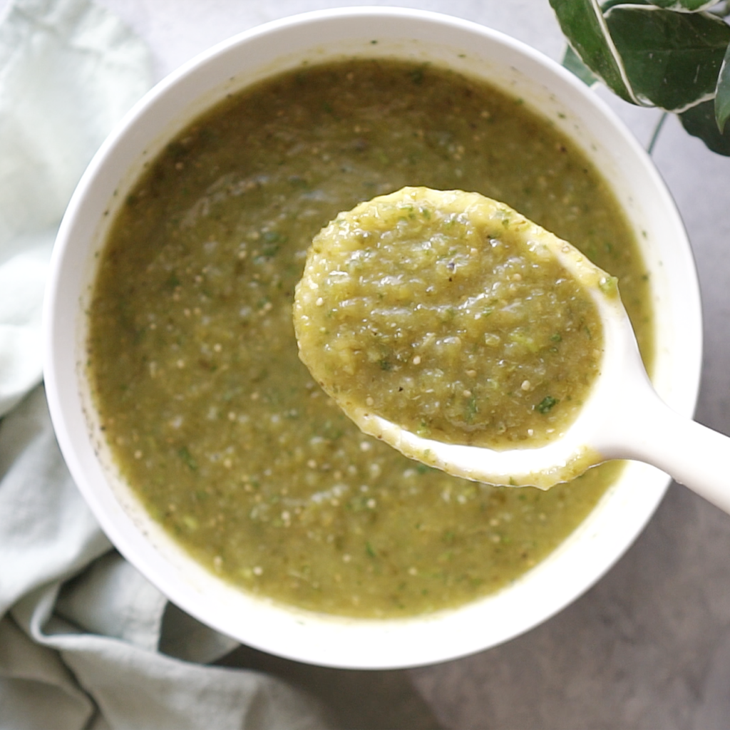 Salsa Verde in a white bowl with a large spoon