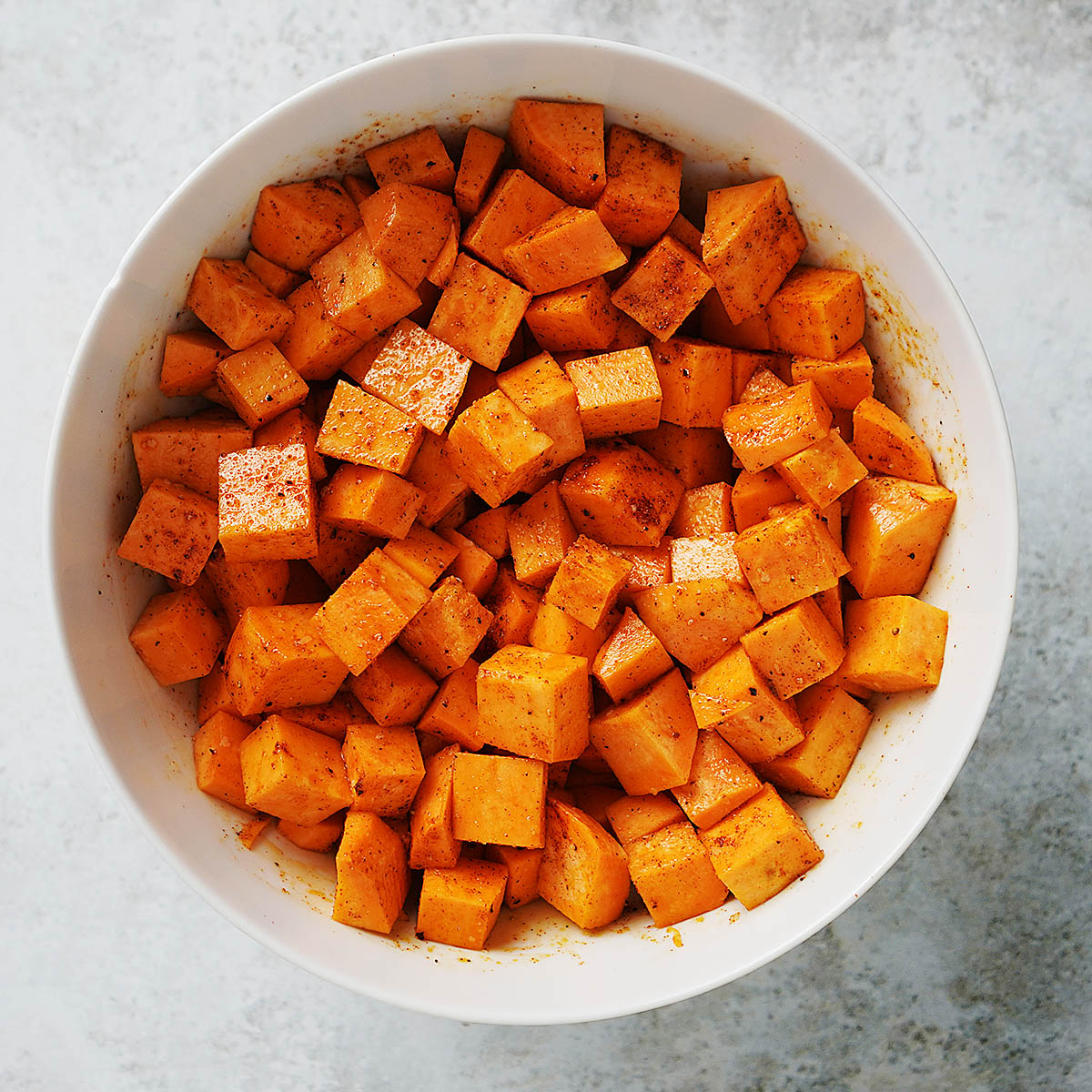 A bowl with sweet potatoes in chunks