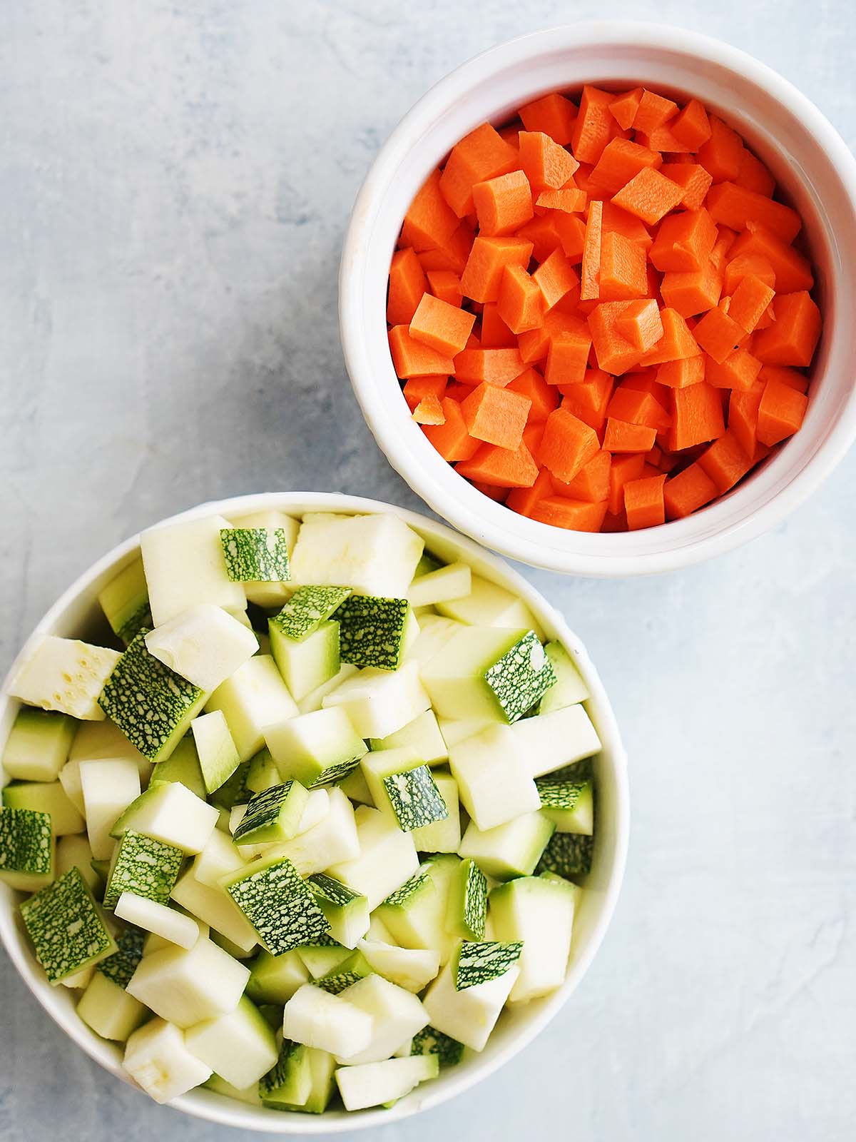 chopped zucchini and chopped carrots in a small bowl.