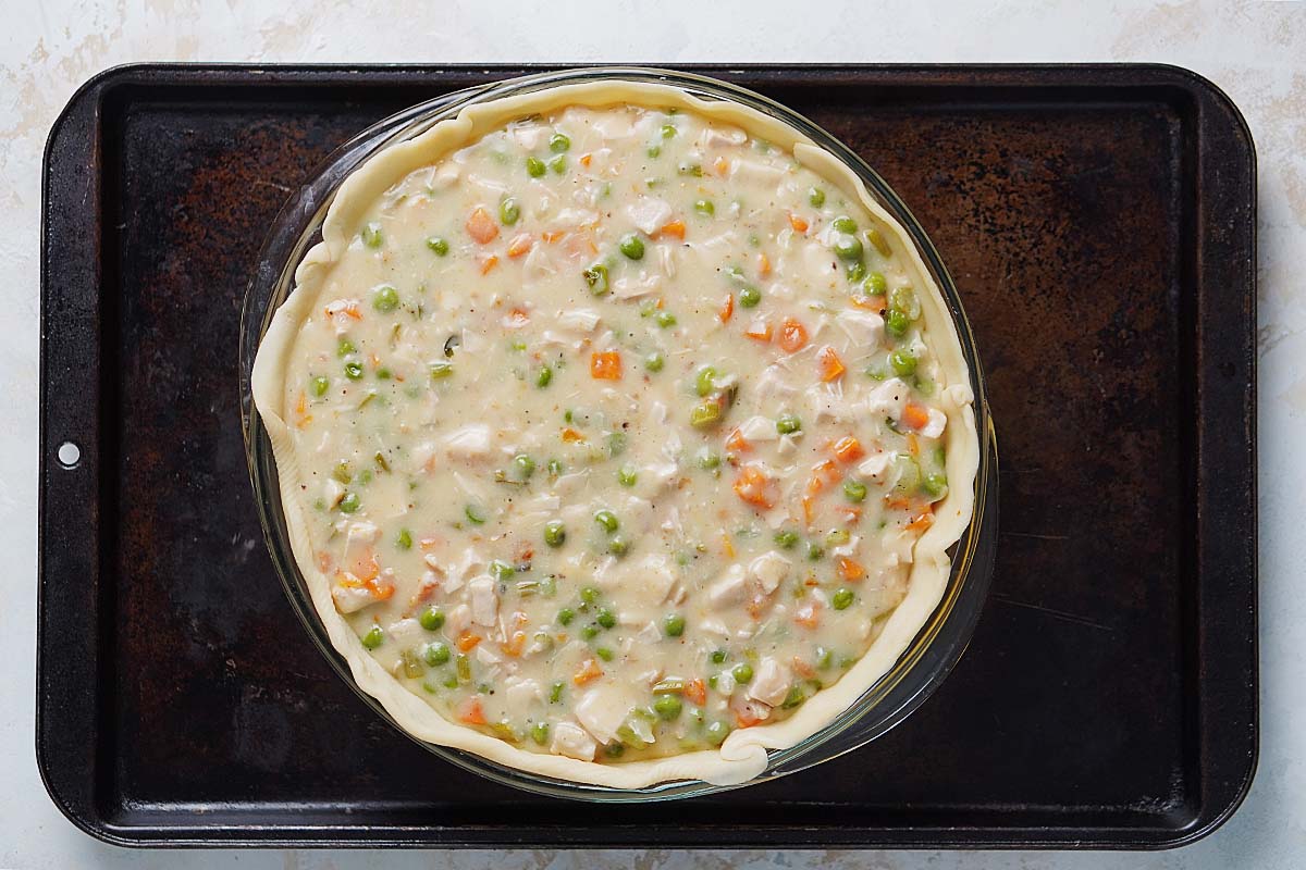 The pot pie placed on top of a baking sheet.
