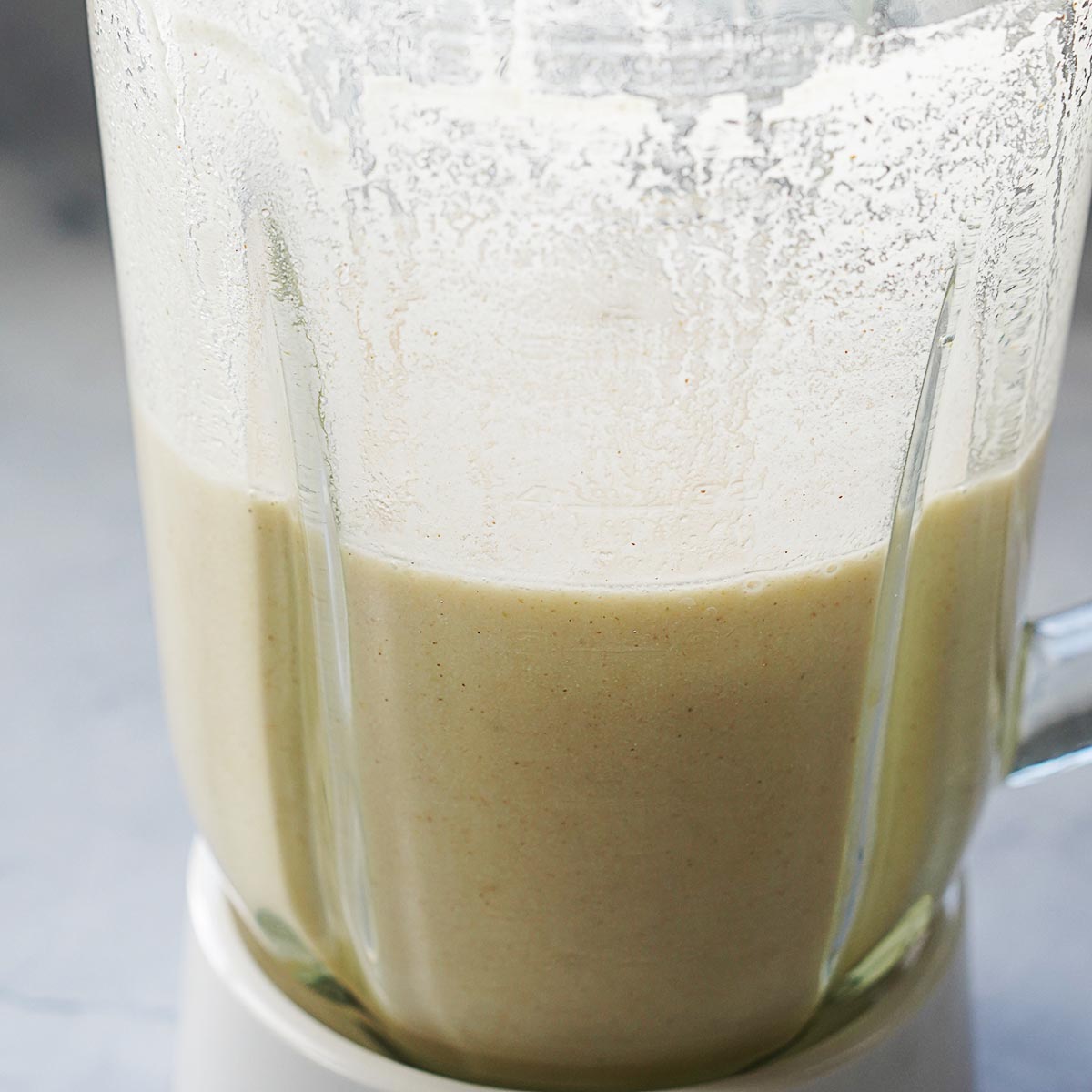 A blender with blended masa in water.