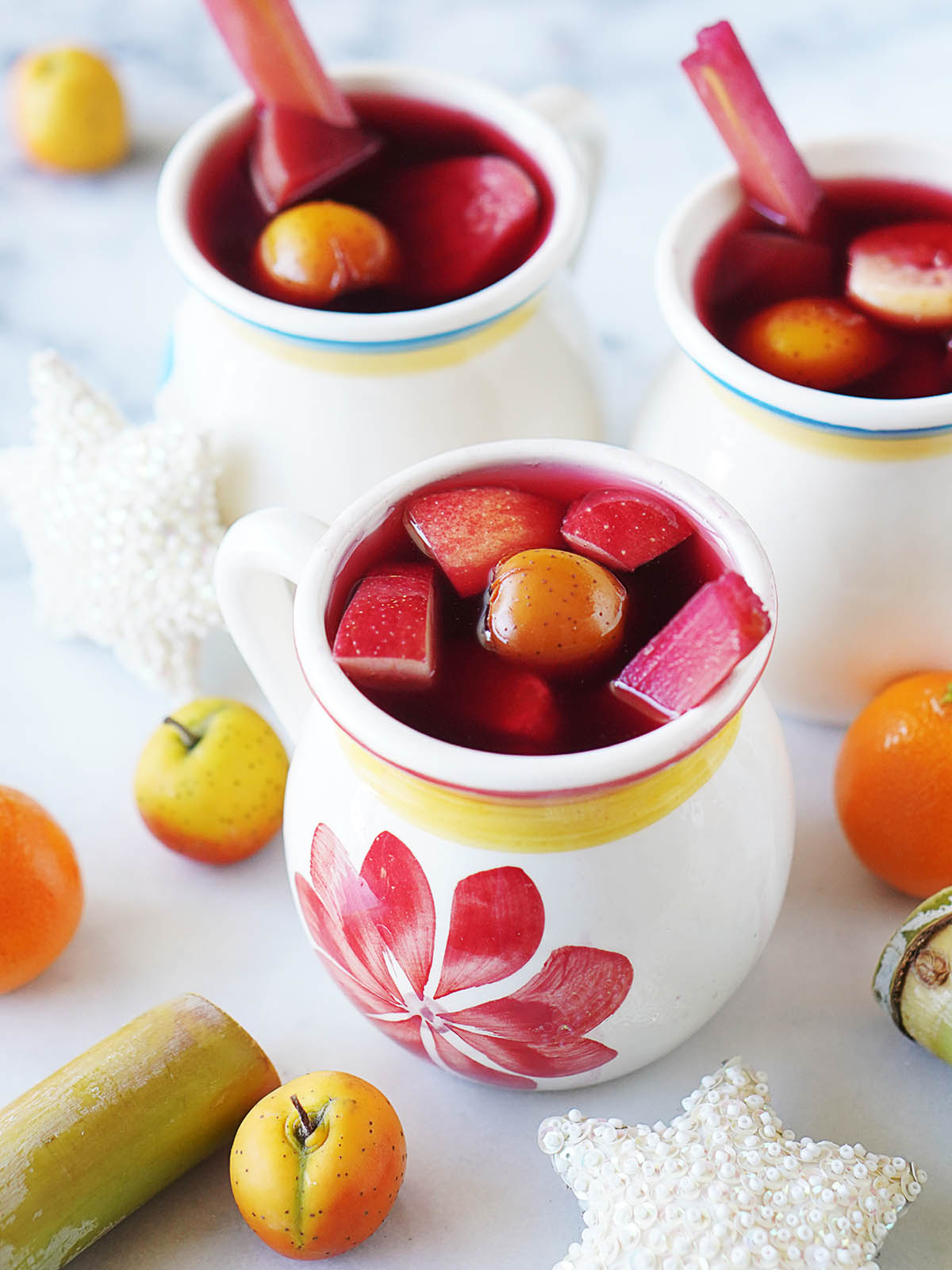 3 white mugs with Mexican Christmas punch.