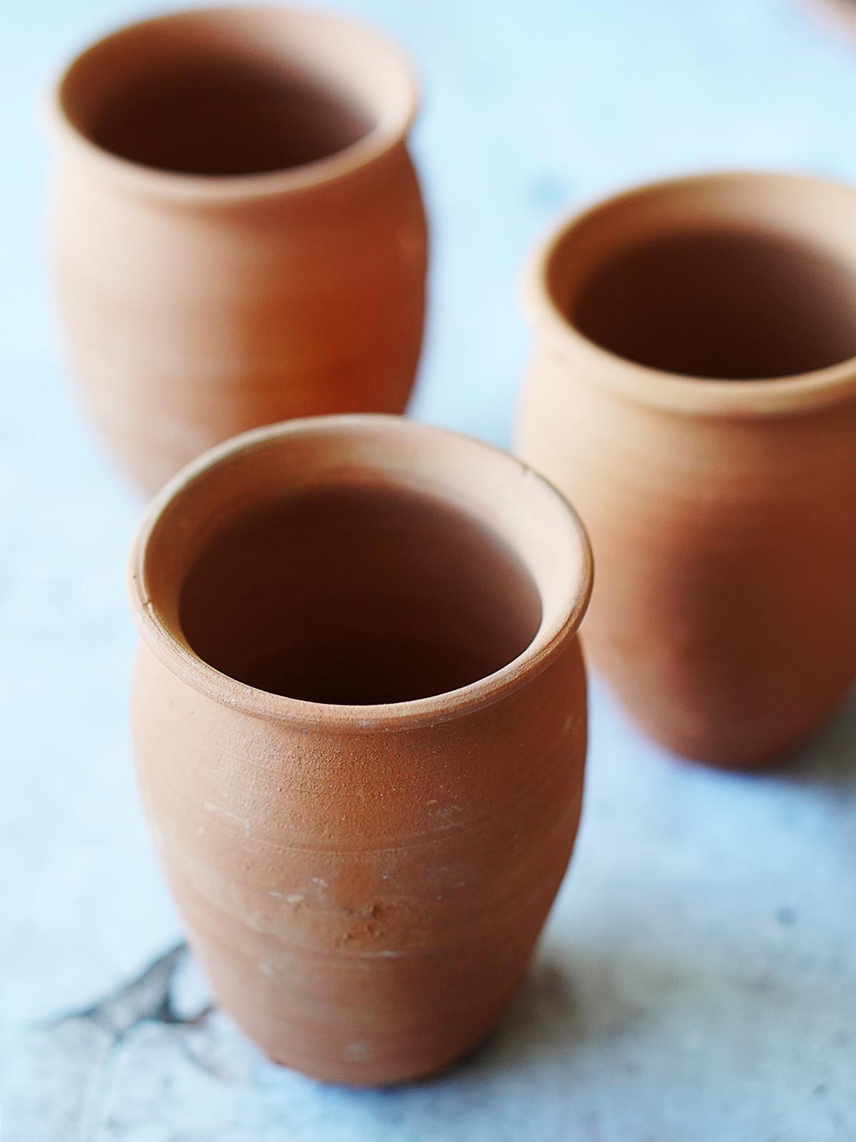 3 empty cantarito clay cups.
