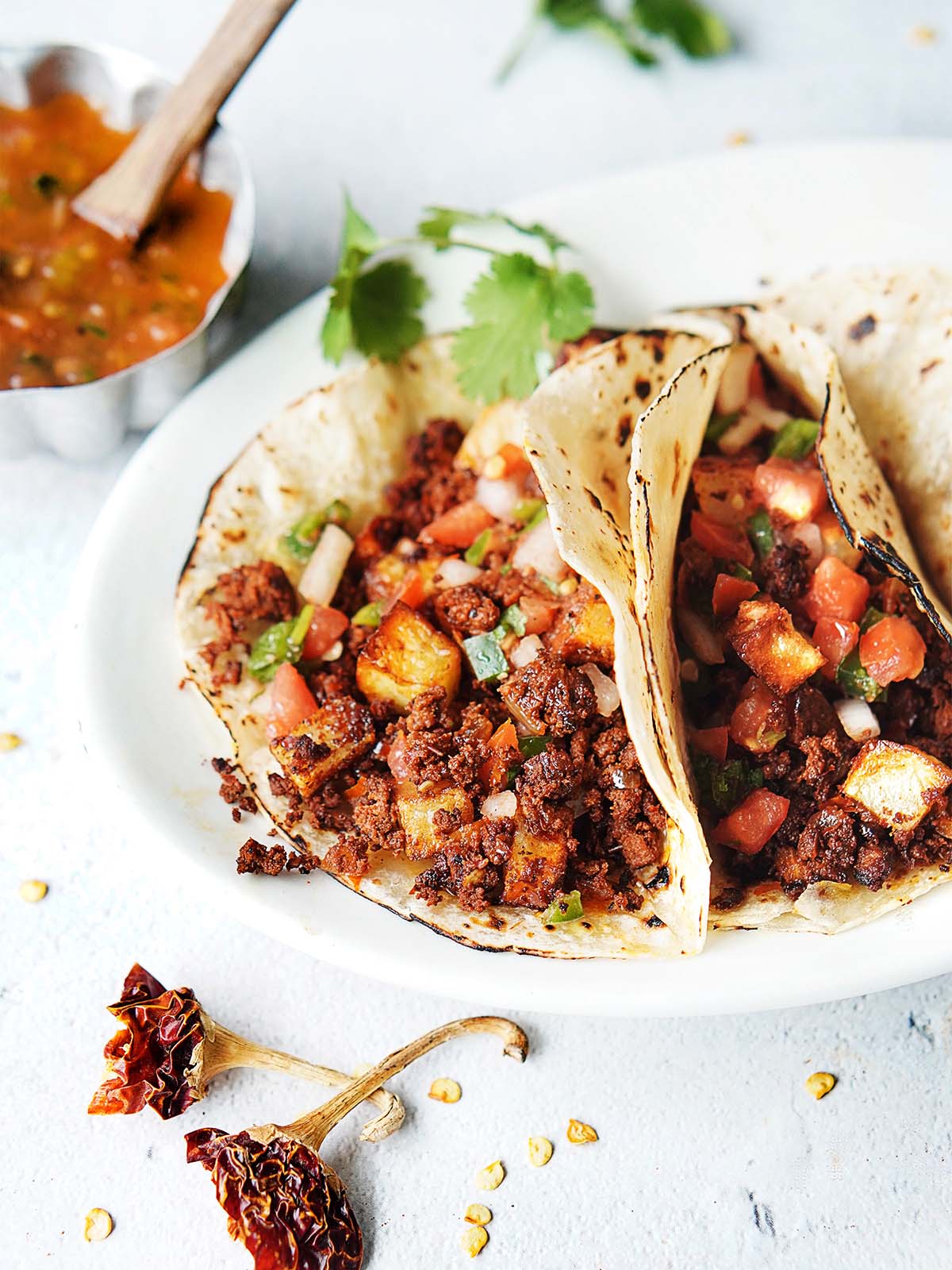 Two tacos with chorizo and potatoes.