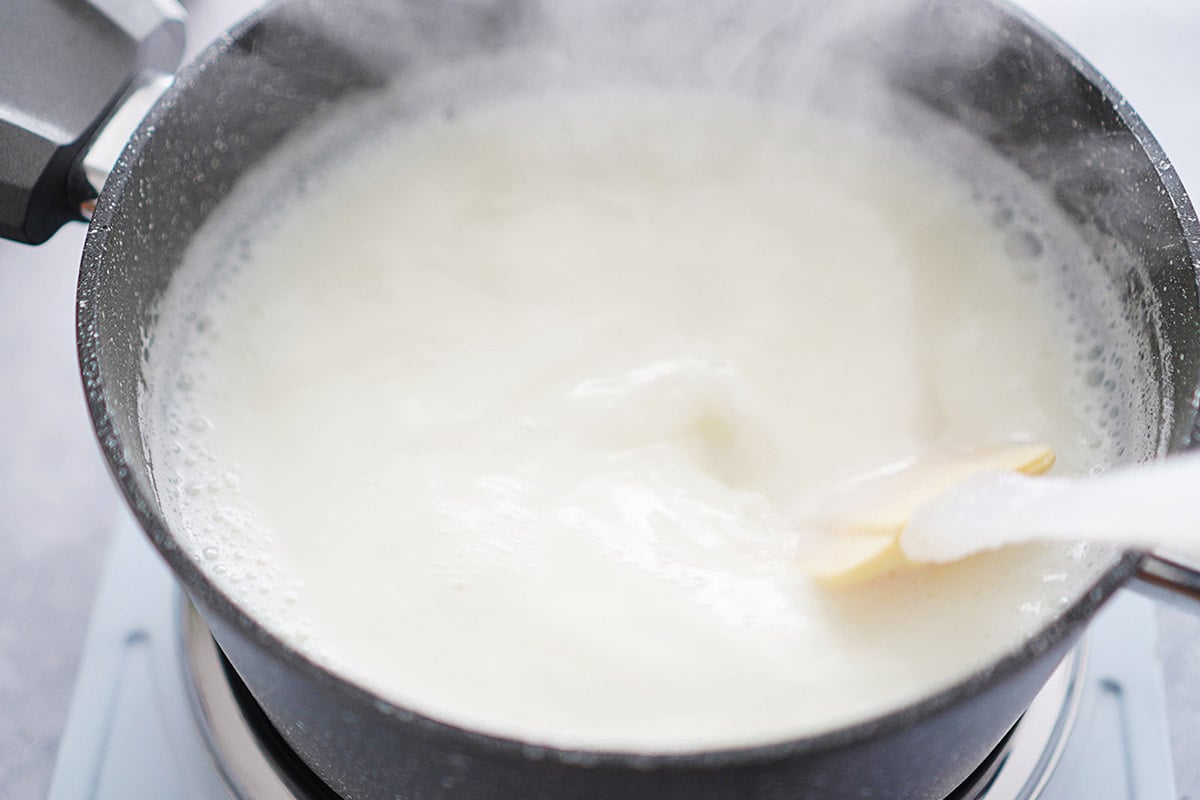 A pot with boiling milk.