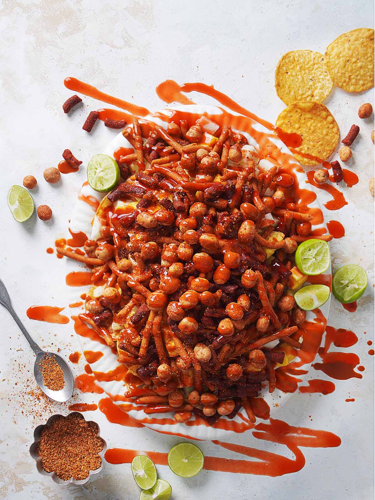 A plate filled with spicy Mexican candy and jicama drizzled with chamoy.