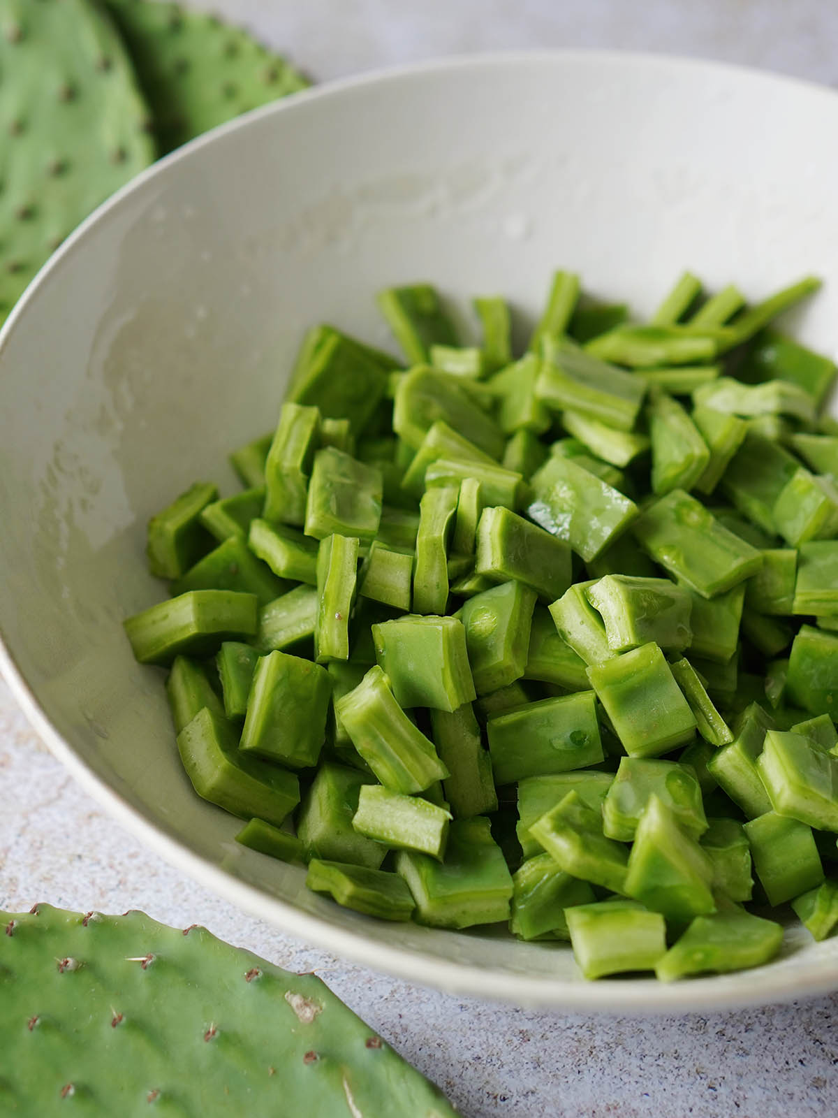A white bowl with cubed nopales.
