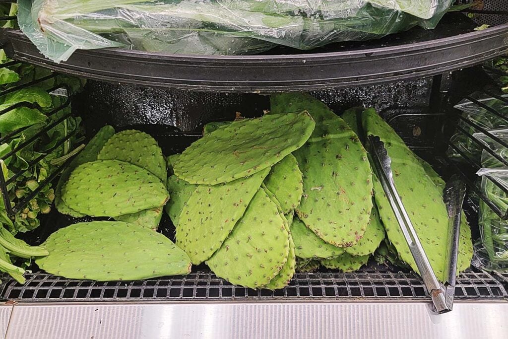 A stack of nopales paddles at the grocery store.