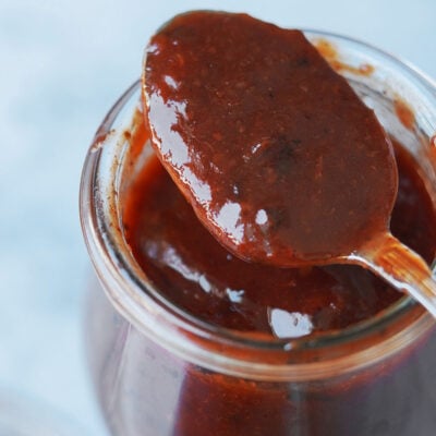 Close up photo of Homemade chamoy on a spoon.