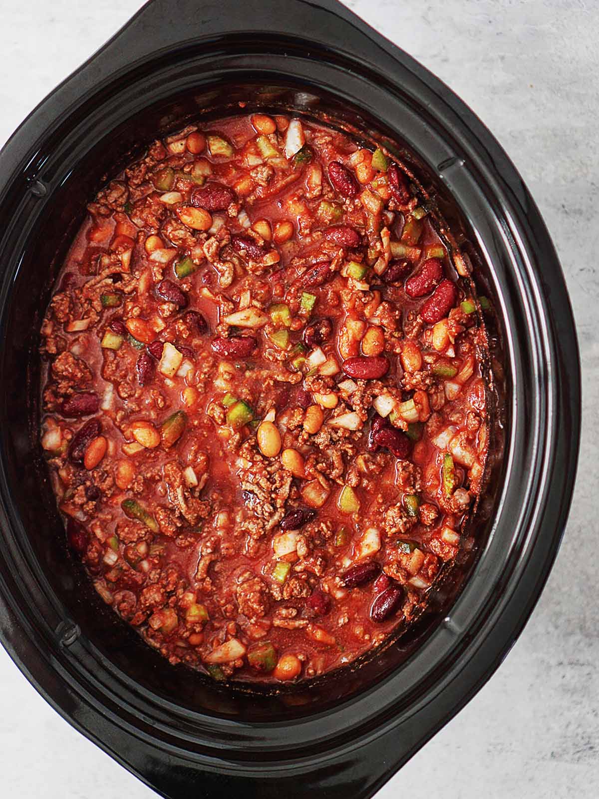 Beef chili in the dish of a crockpot.
