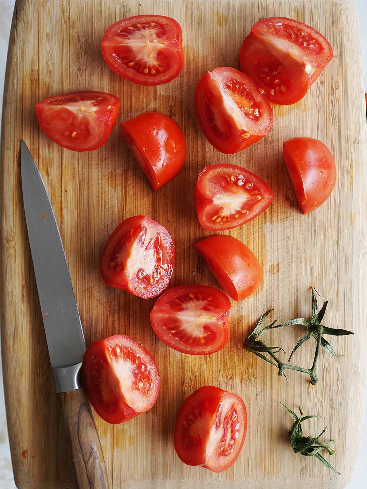 Chopped tomatoes on a cutting board.