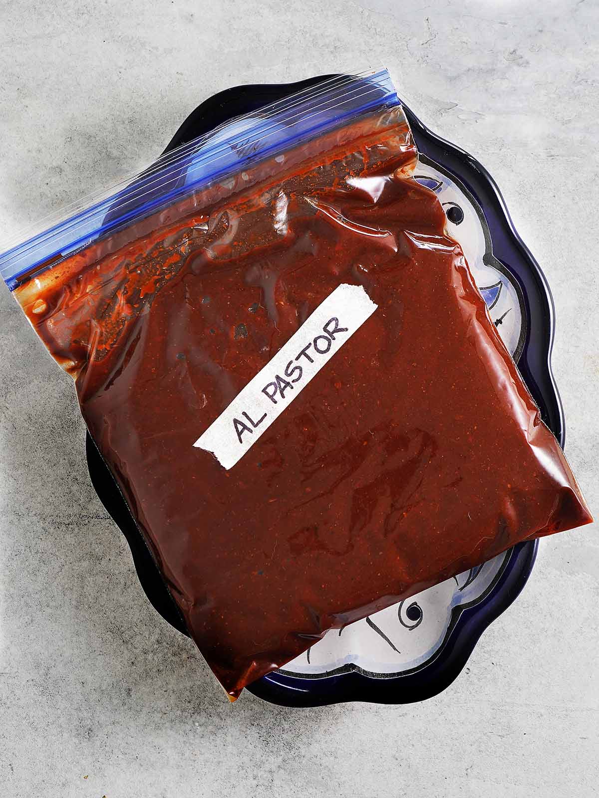 Al Pastor Marinade placed in a ziploc bag ready to be frozen.