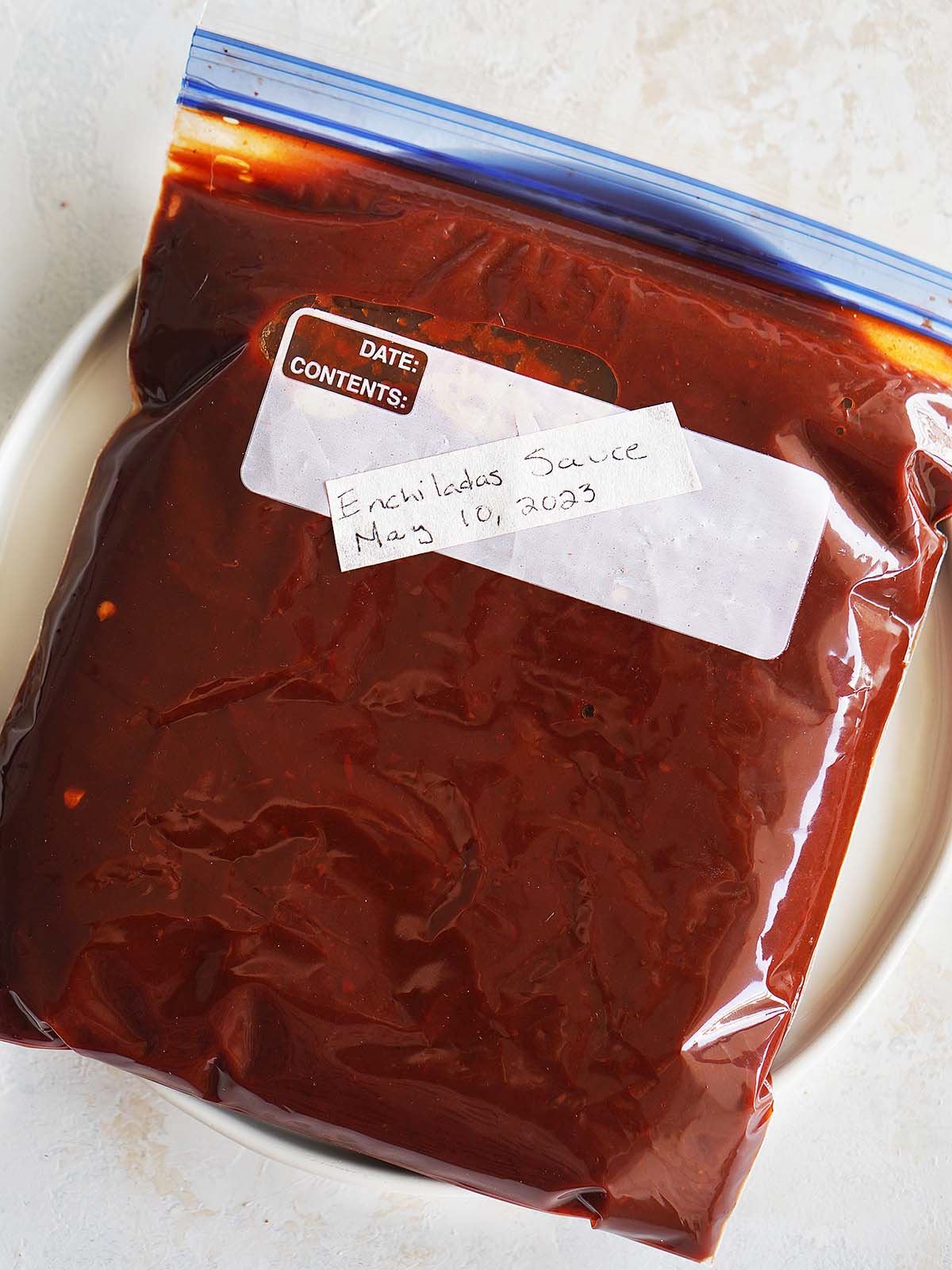 A ziploc bag with the chile sauce ready to be frozen.