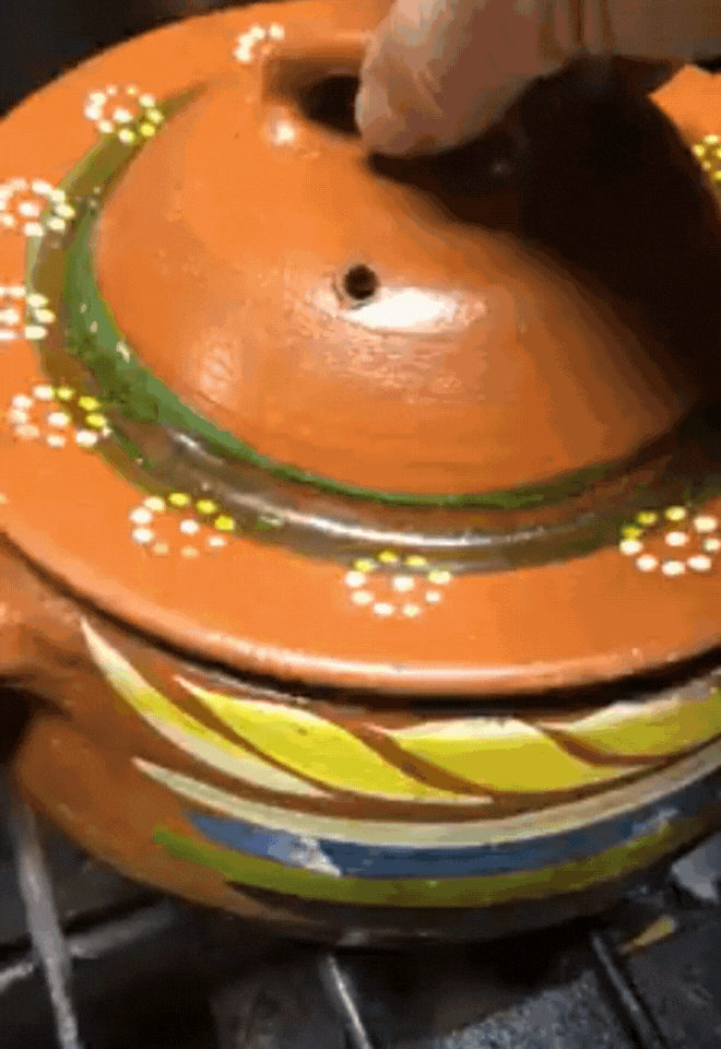 A gif of a boiling coffee in a clay pot.