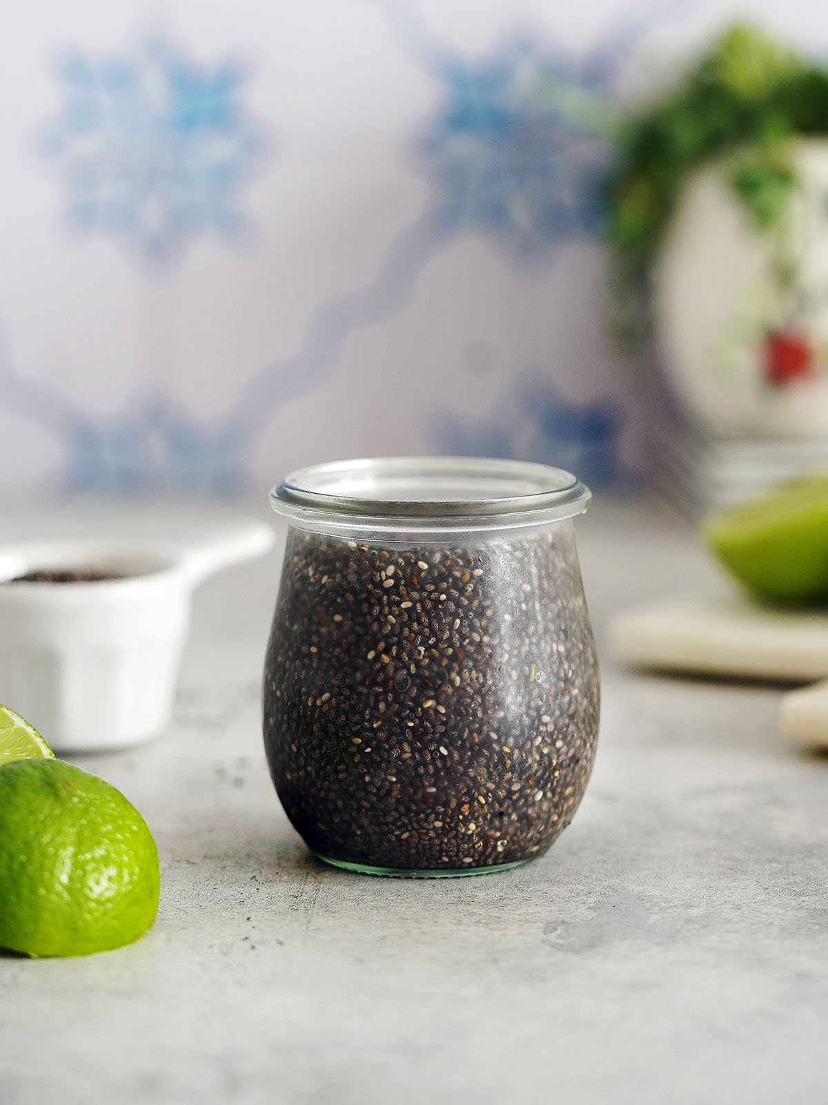 A small jar filled with hydrated chia seeds.