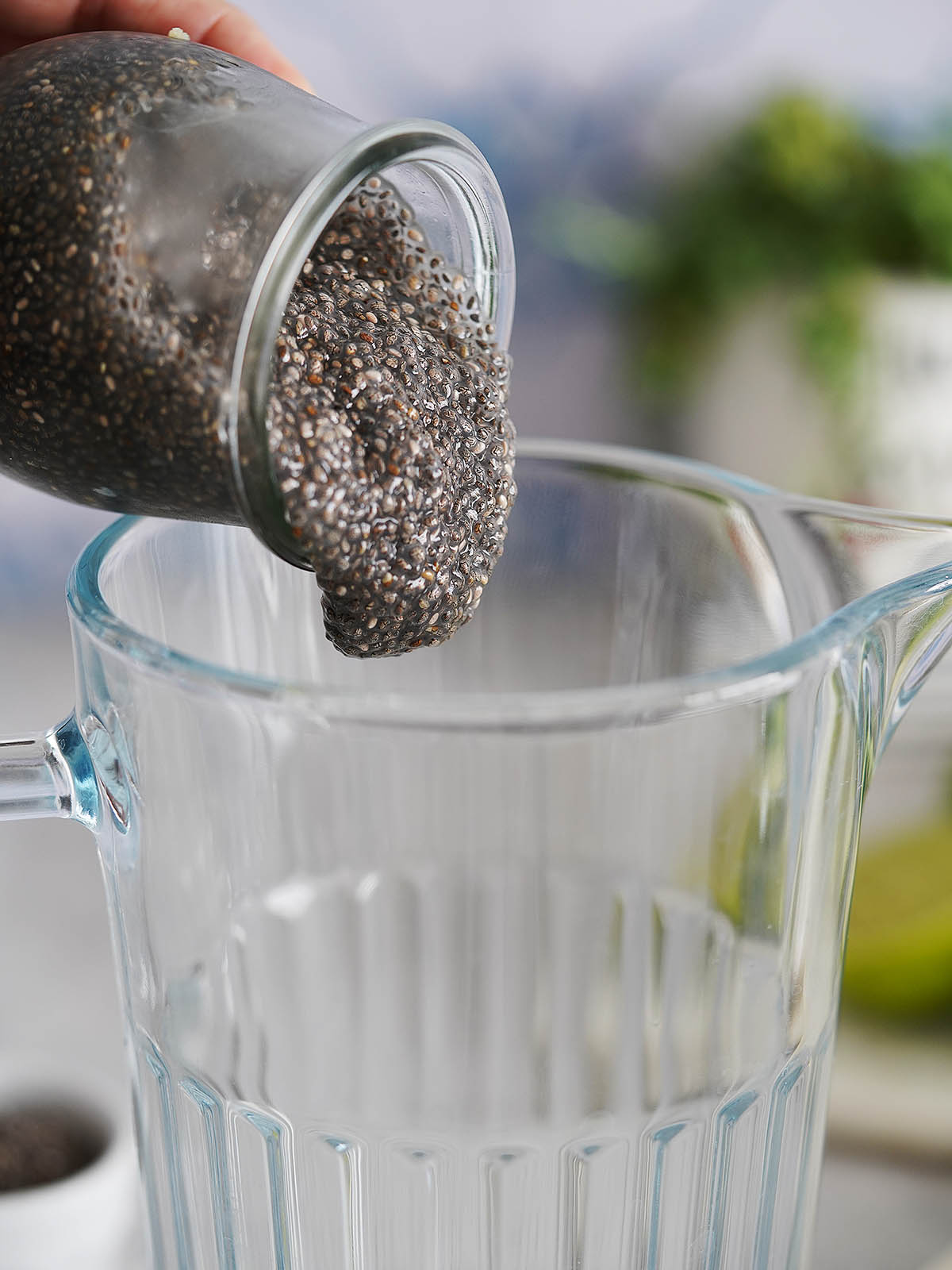Adding the chia seeds into a jar.