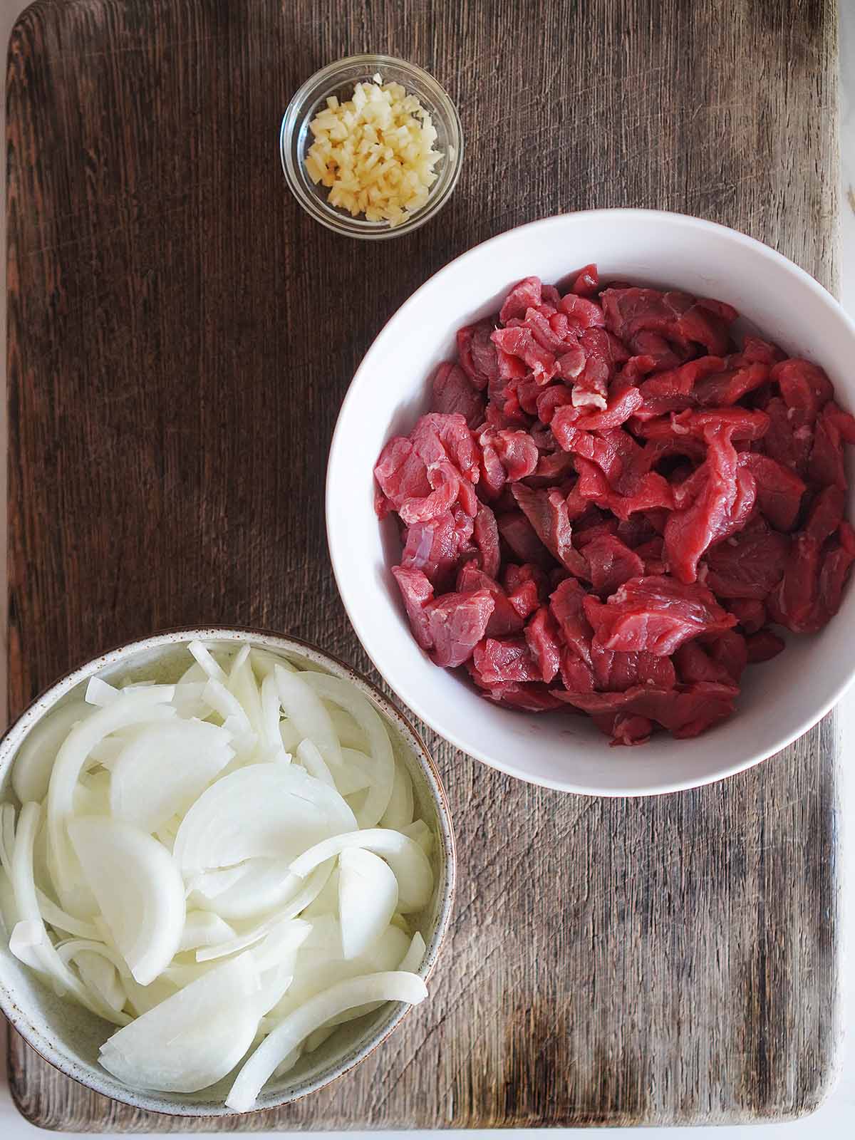 The ingredients for this recipe on a cutting board placed in bowls.