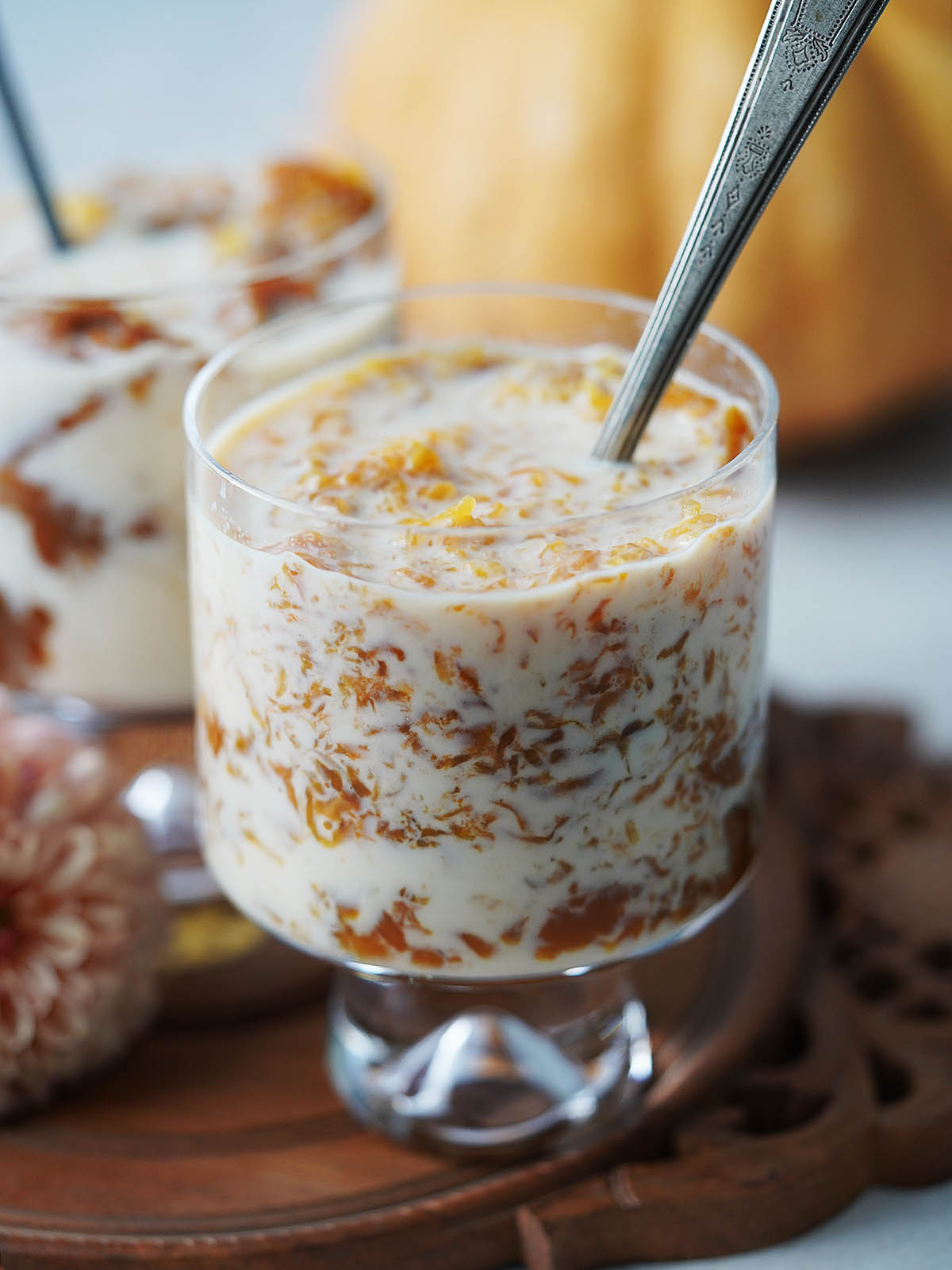 A cup with dulce de calabaza and milk mixed in.