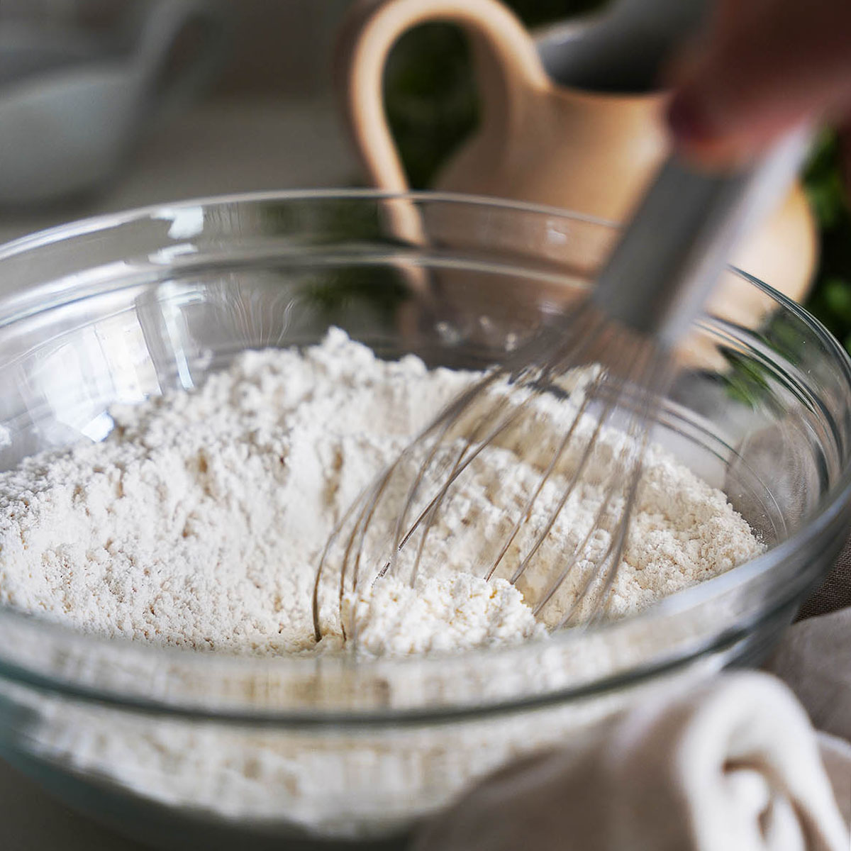 Whisking the flour in a bowl.