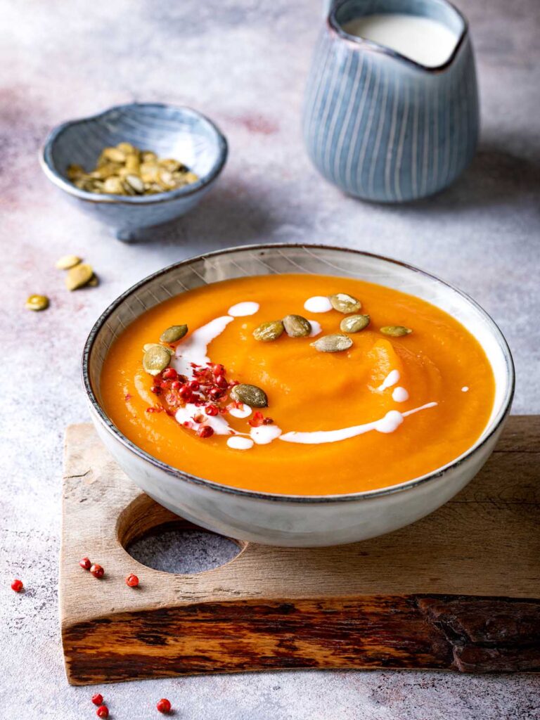 Vegetarian pumpkin soup with cream, seeds and spices.