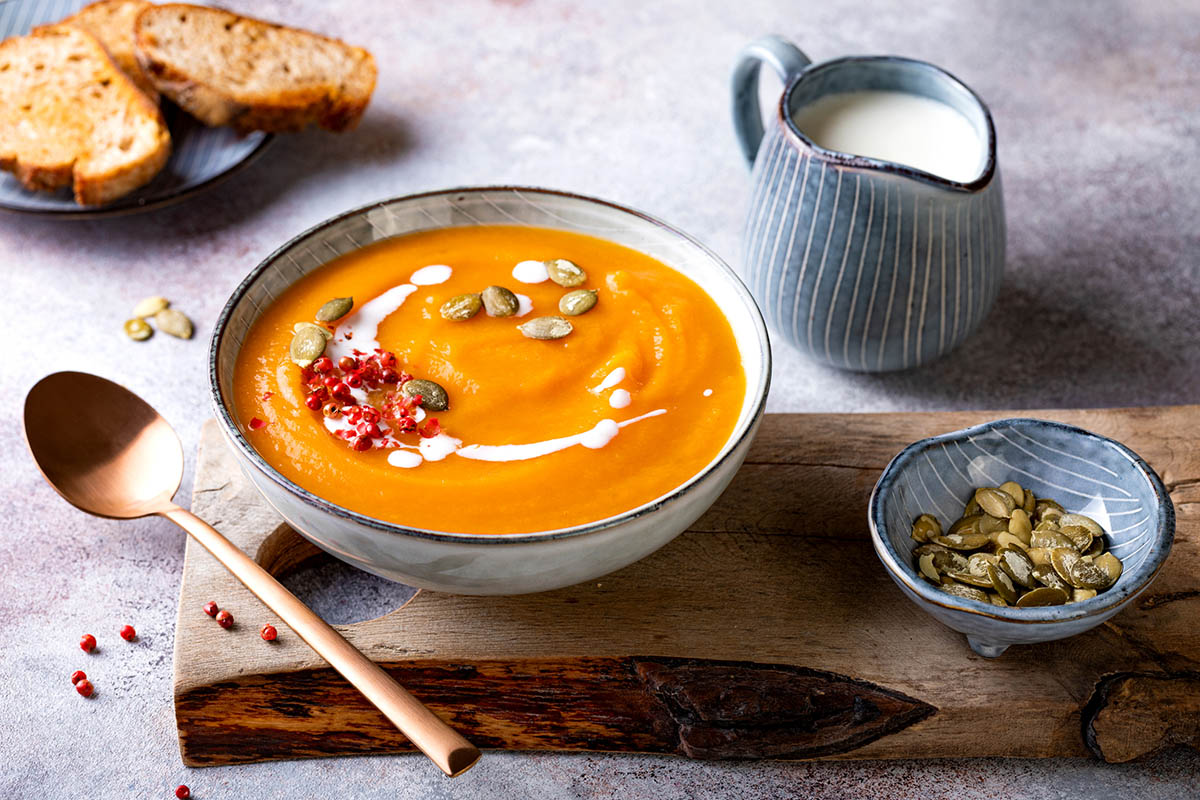 Vegetarian pumpkin soup with cream, seeds and spices.