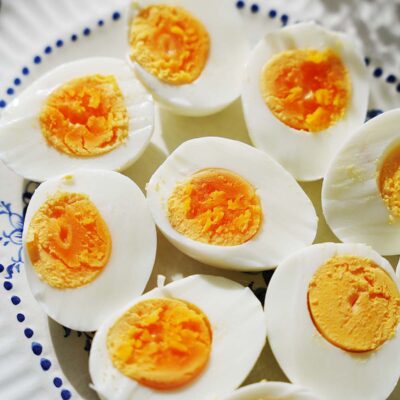 6 boiled eggs cut in half placed on a platter.