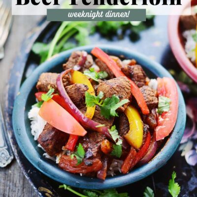 A bowl with rice topped with mexican beef tenderloin.
