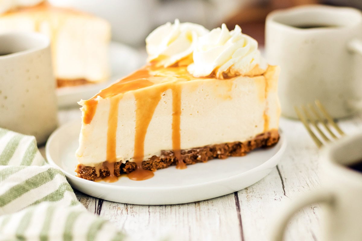 A slice of cheesecake placed on a white plate.