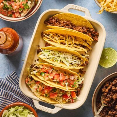 Building the hard shell tacos layer by layer.